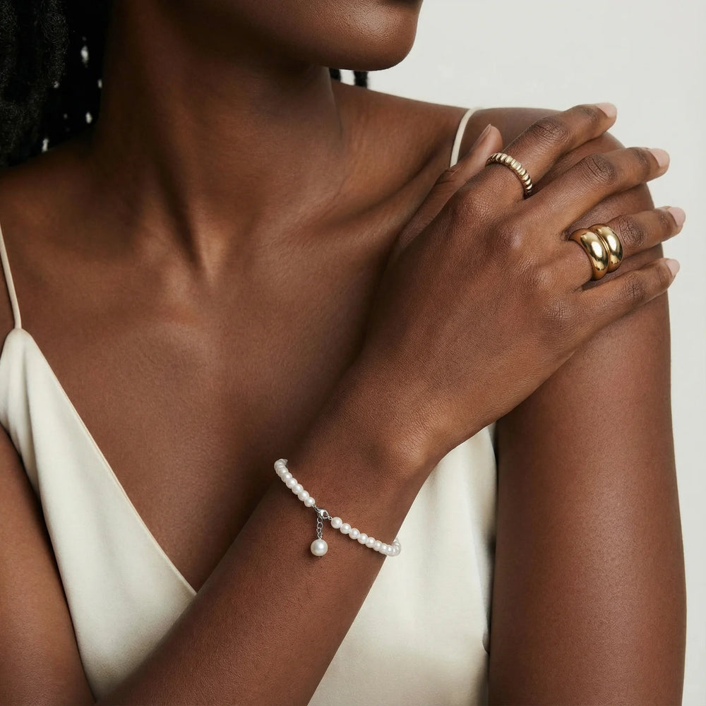 Delicate freshwater pearl bracelet 925 silver worn on wrist showing adjustable chain