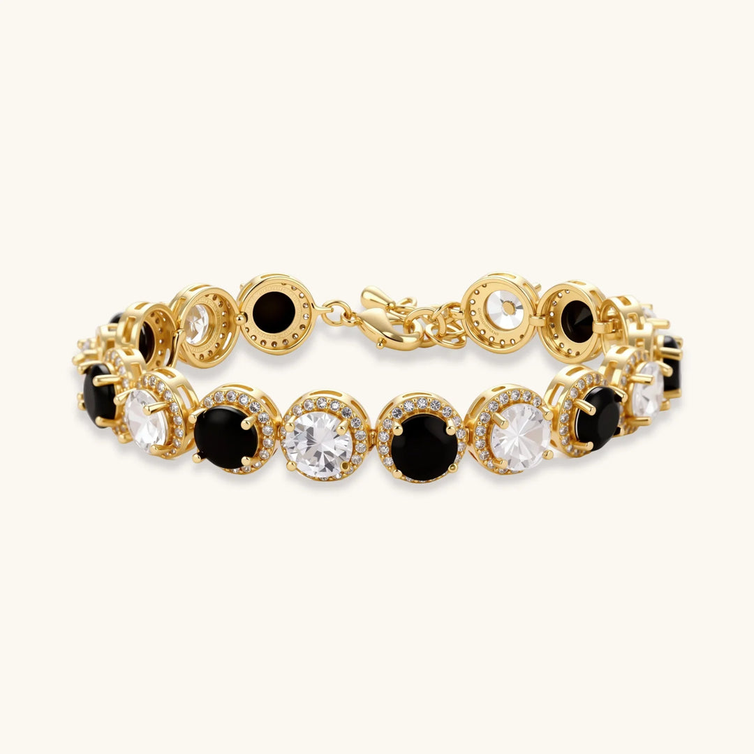Gold-plated jewelry set with alternating black and clear cubic zirconia stones, featuring necklace, earrings and bracelet