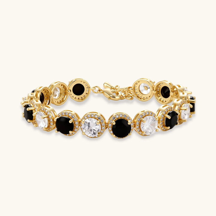 Gold-plated jewelry set with alternating black and clear cubic zirconia stones, featuring necklace, earrings and bracelet