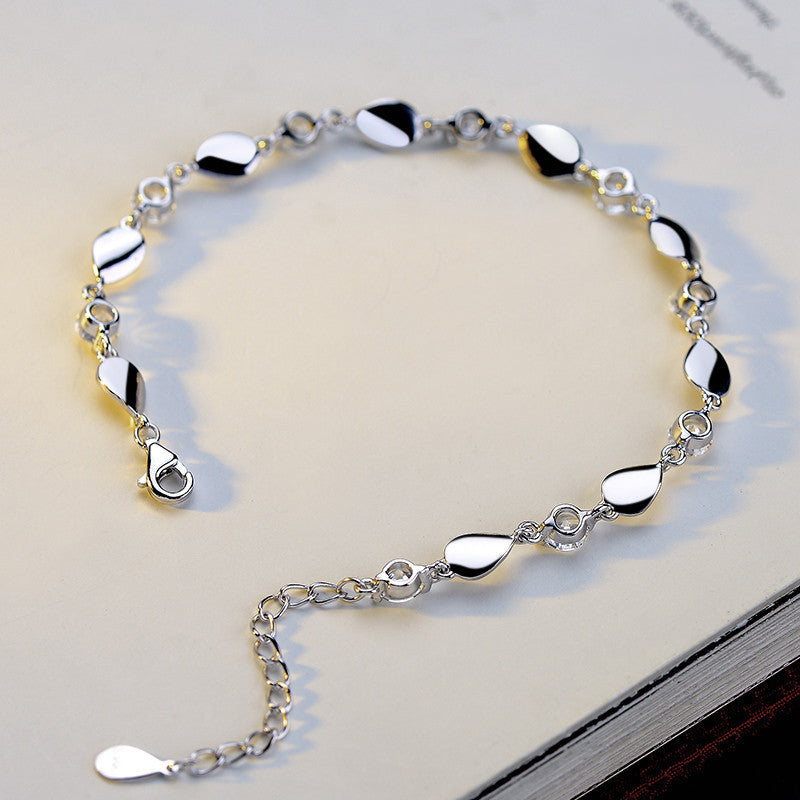 Diamond-encrusted 925 sterling silver bracelet.
