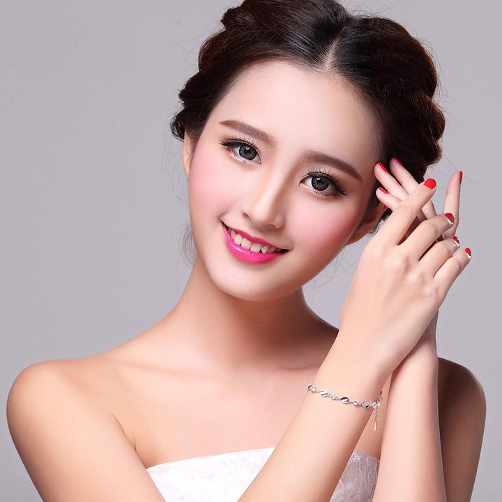 Diamond-encrusted 925 sterling silver bracelet.