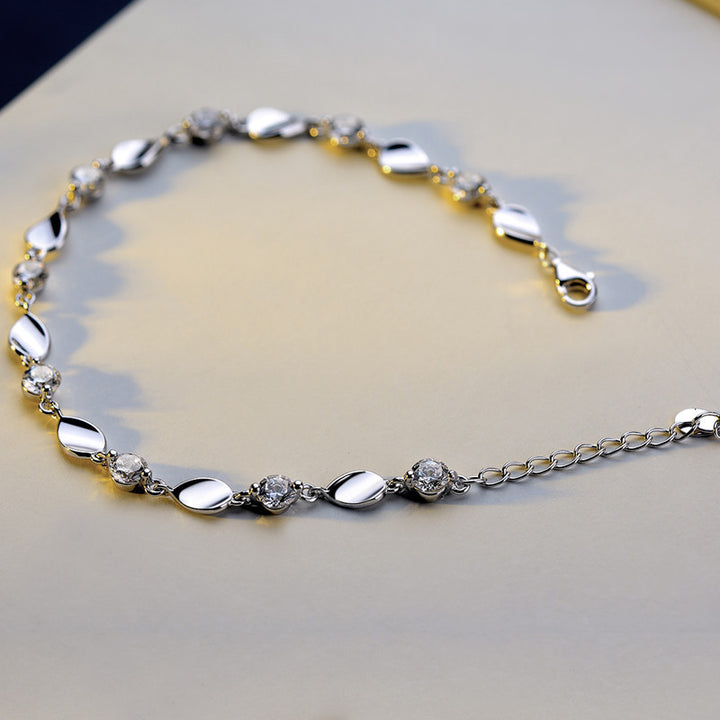 Diamond-encrusted 925 sterling silver bracelet.