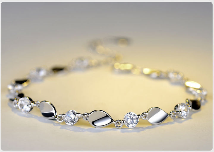 Diamond-encrusted 925 sterling silver bracelet.